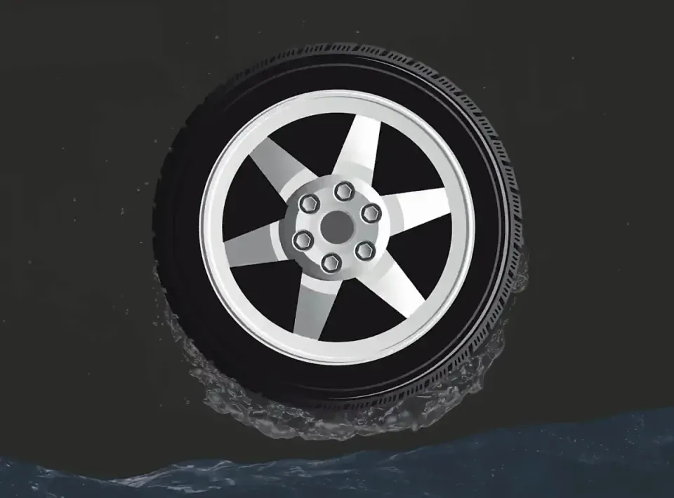 Car driving fast through a layer of water: the tyres no longer touch the road (aquaplaning)