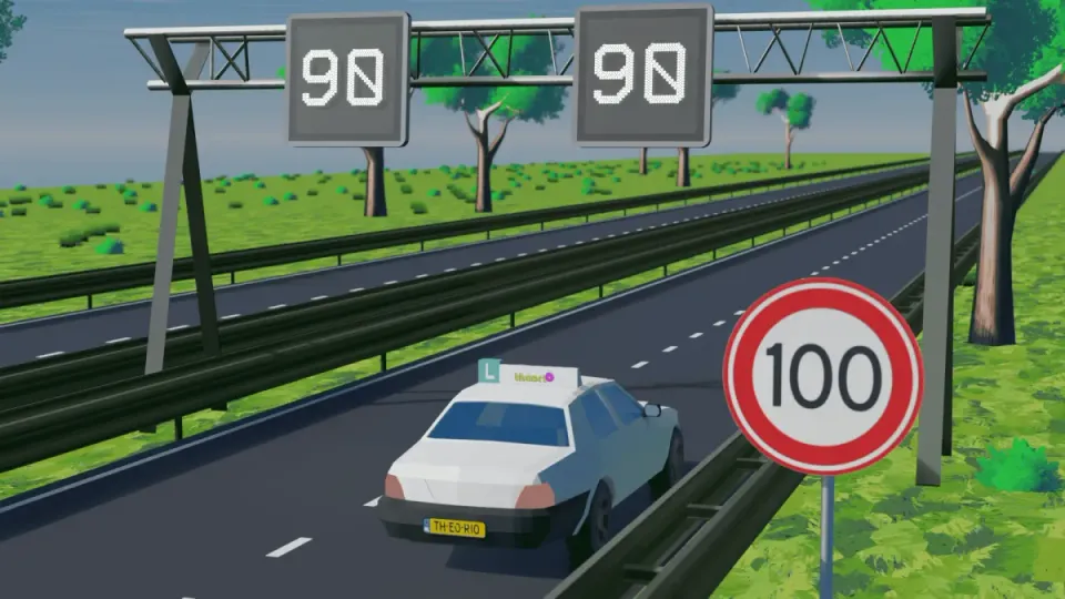 Motorway with matrix signs showing 90 above the lanes and a fixed 100 sign at the side of the road