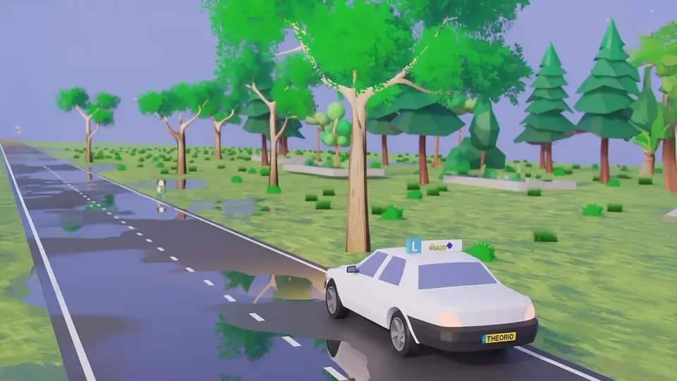 Learner car on a wet road with large puddles on the carriageway