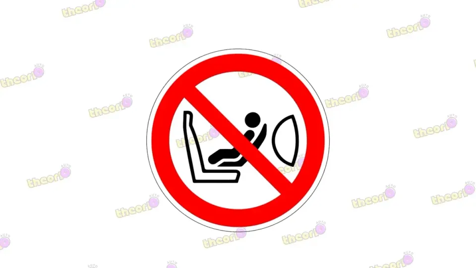 De sticker waarschuwt voor een achterwaarts zitje voor een airbag die aan staat.