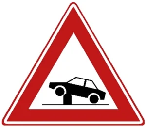 Waarschuwing voor elektrische in- en uitschuifbare paal in de rijbaan (poller) waarmee toegankelijkheid van straten en gebieden kan worden geregeld.